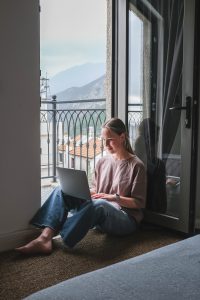 Remotely work.freelancer works remotely home.cozy workation, remote work,leisure, work life balance,digital nomad, workation,work travel,remotely work.Travelling.Work vacation remotely