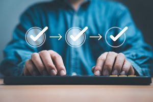 Businessman typing with approval work flow for online business management review , project and document approve concept.